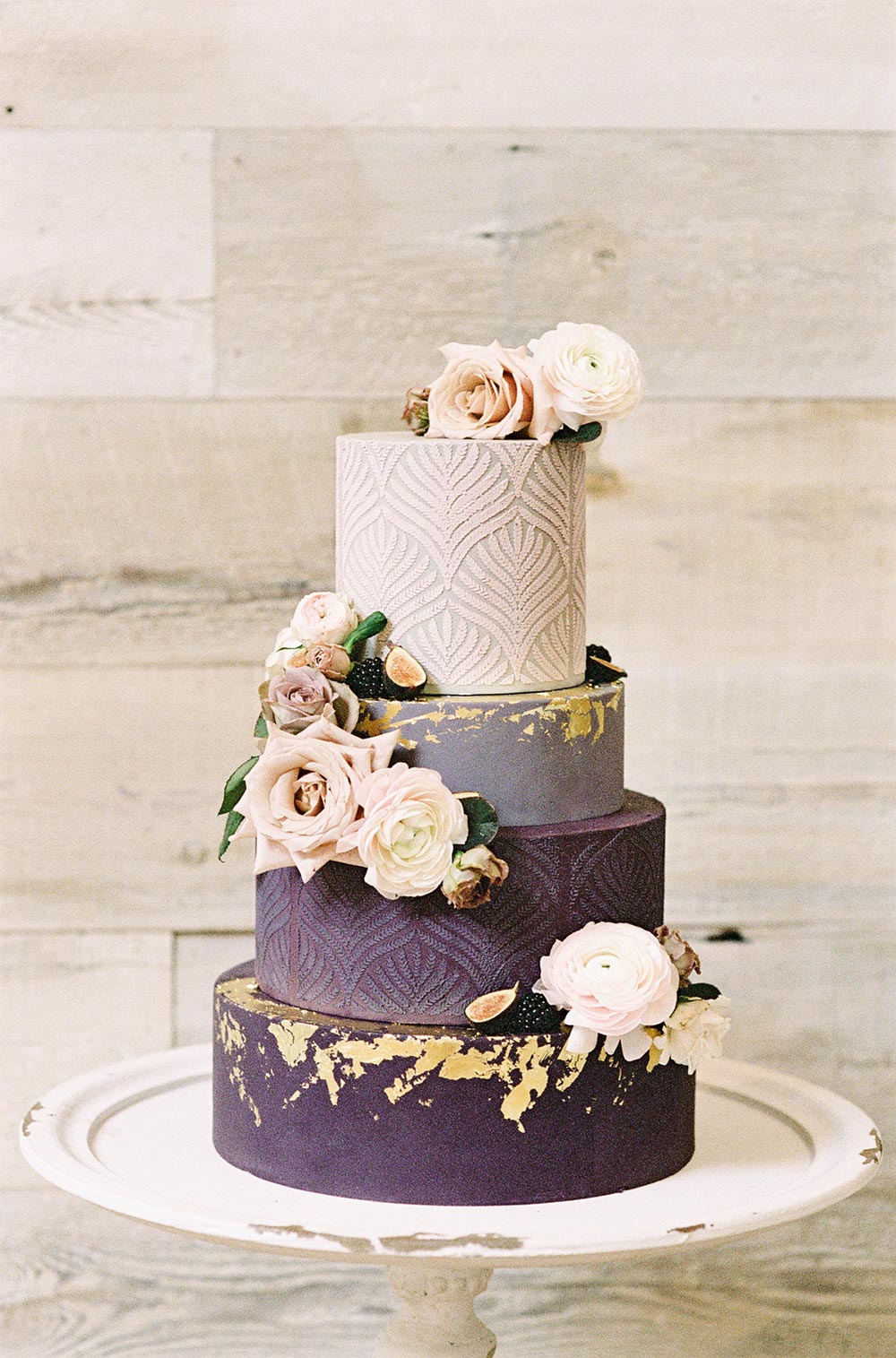 plum and pink wedding cake with gold foil