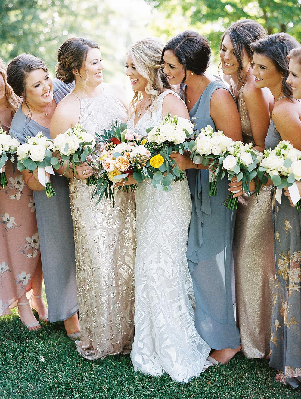 patterned wedding dress with mismatched printed bridesmaid dresses