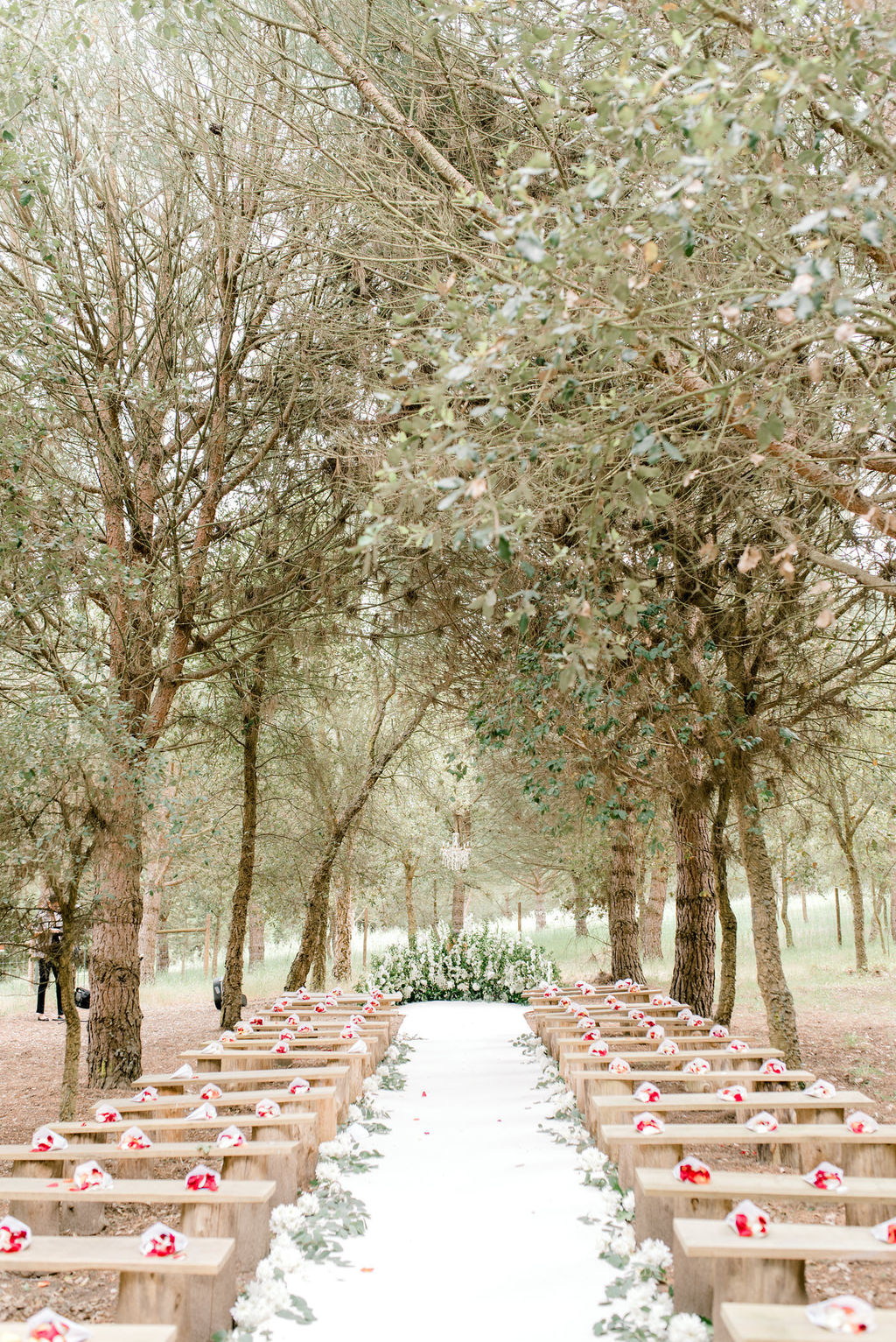 classic forest wedding with floral crescent wedding ceremony backdrop