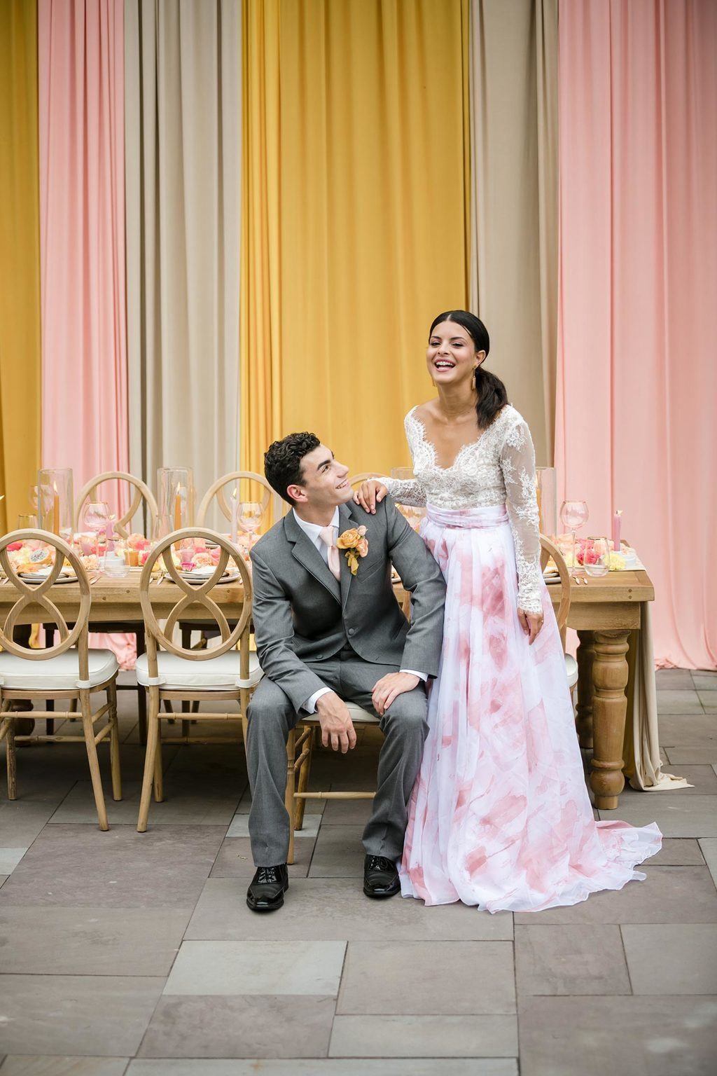 pink watercolor bridal skirt with gray groom suit